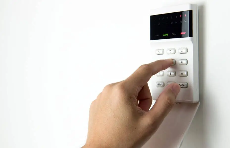 Security alarm pad with person entering code